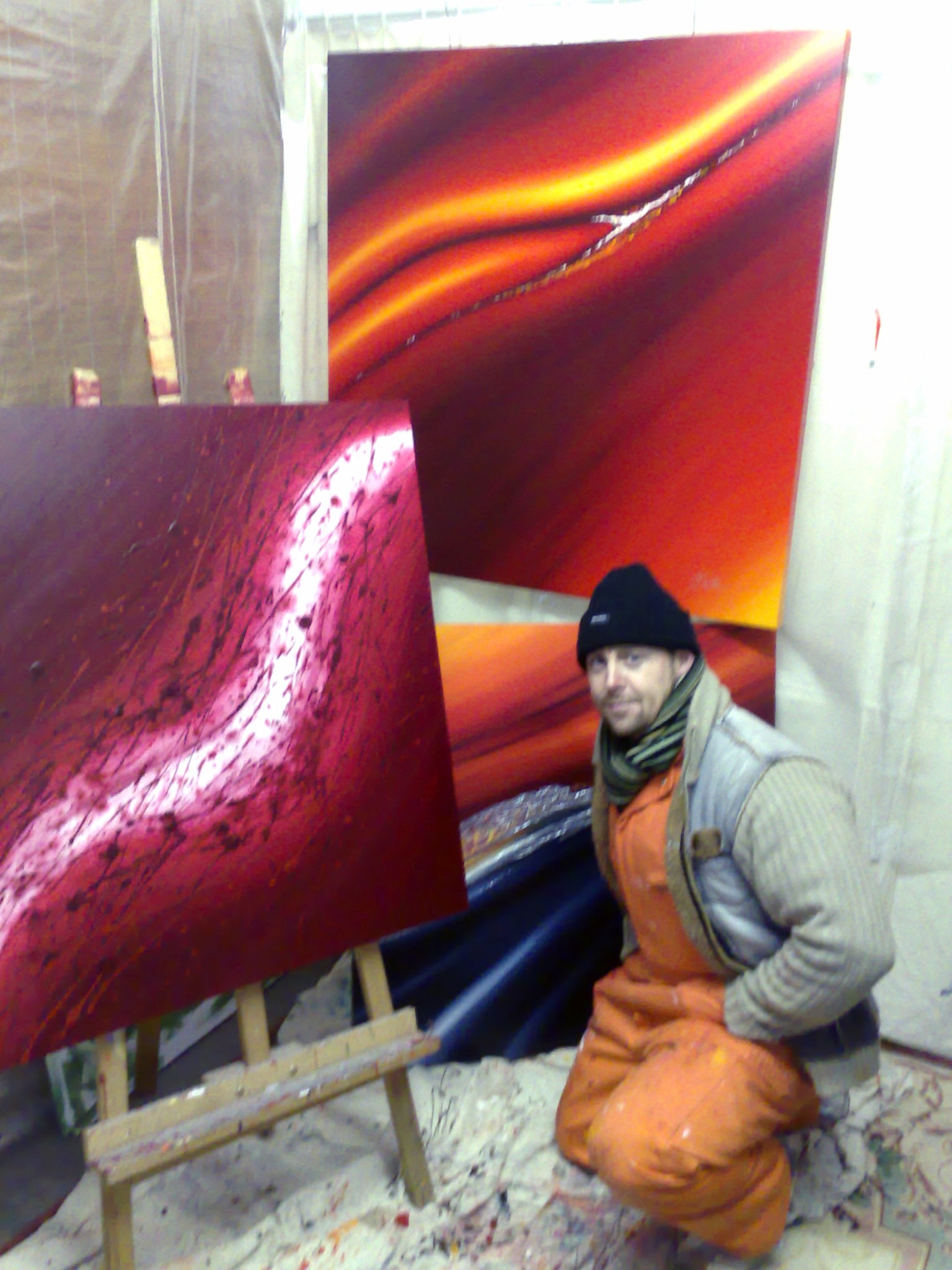 Jay Williamson with canvases in the studio