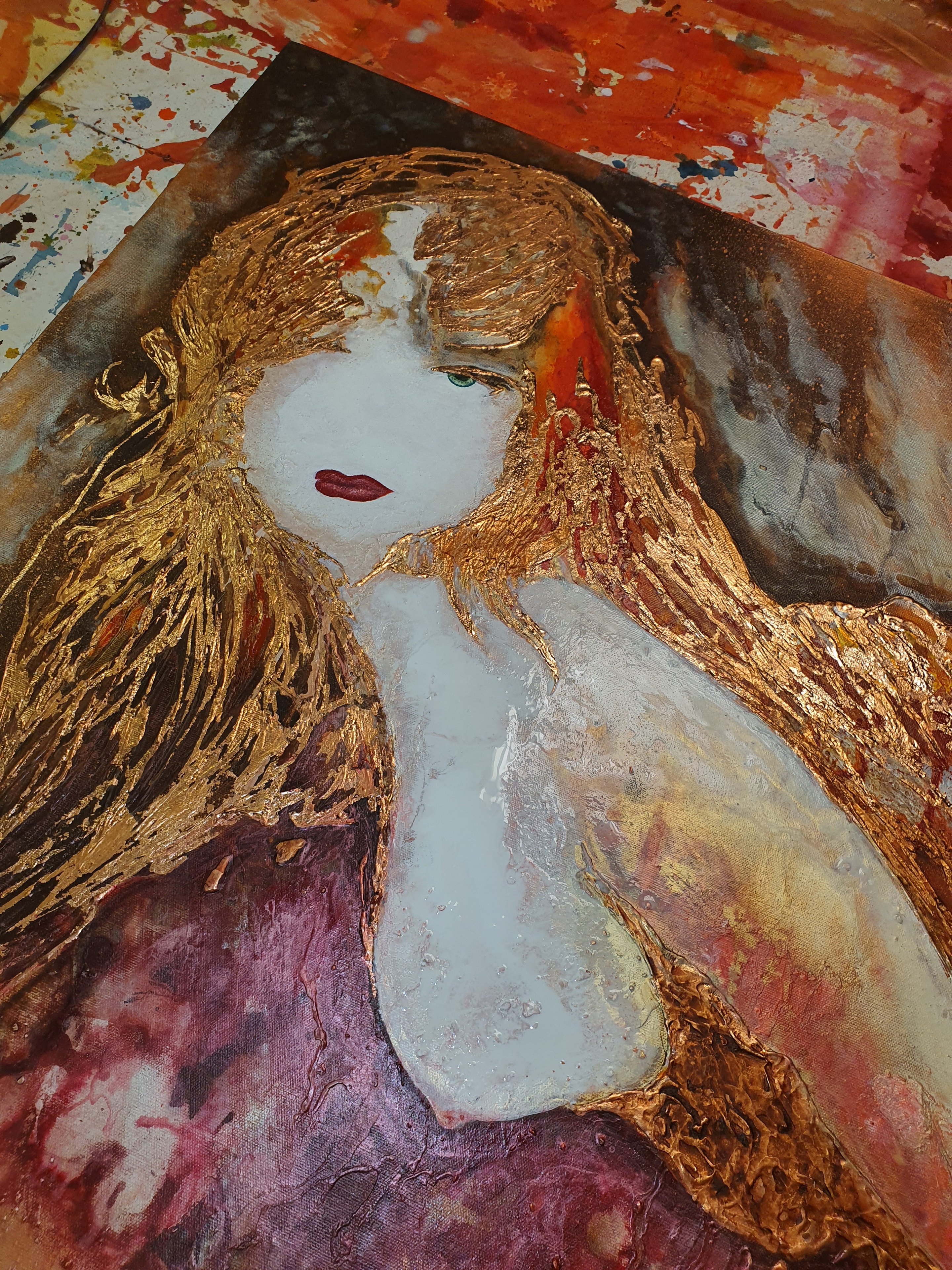 Red and gold leaf canvas in the studio